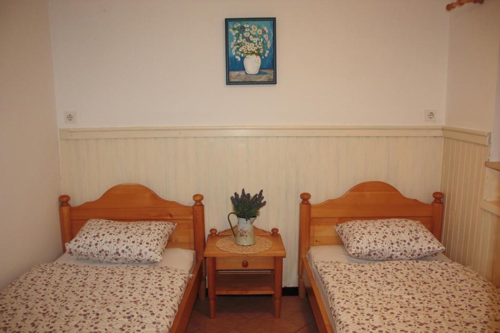 Postel nebo postele na pokoji v ubytování Garden Apartments Maria