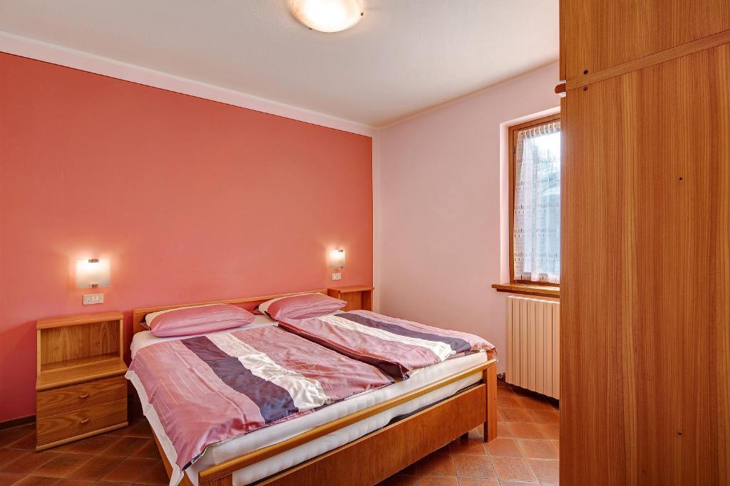 Postel nebo postele na pokoji v ubytování Chalet Meridiana Appartamento 4
