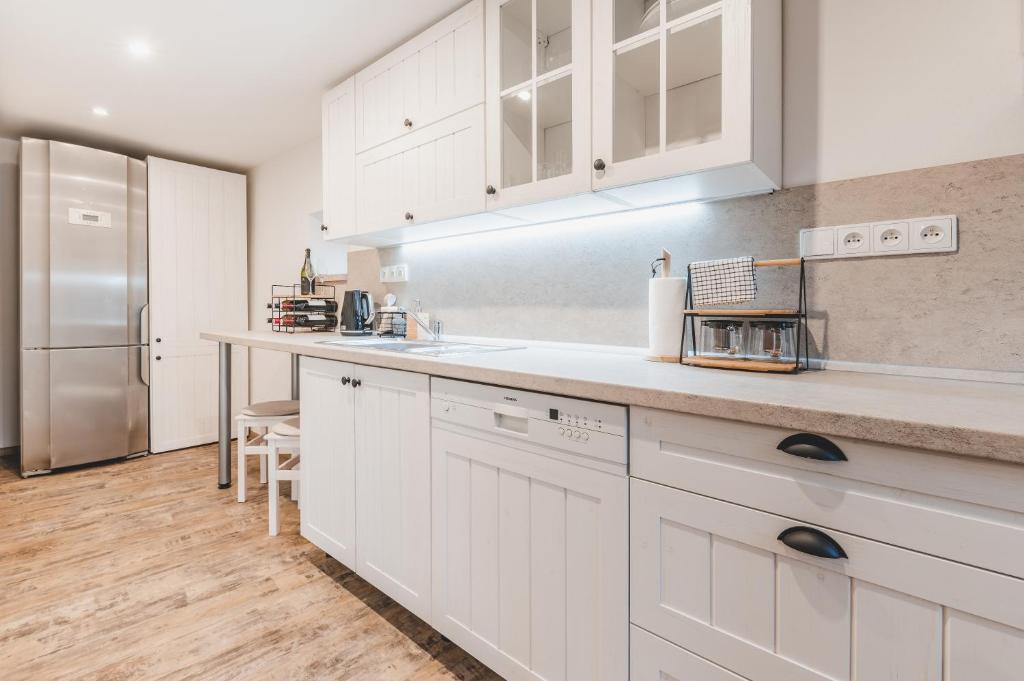 Kuchyň nebo kuchyňský kout v ubytování Konekt Apartment