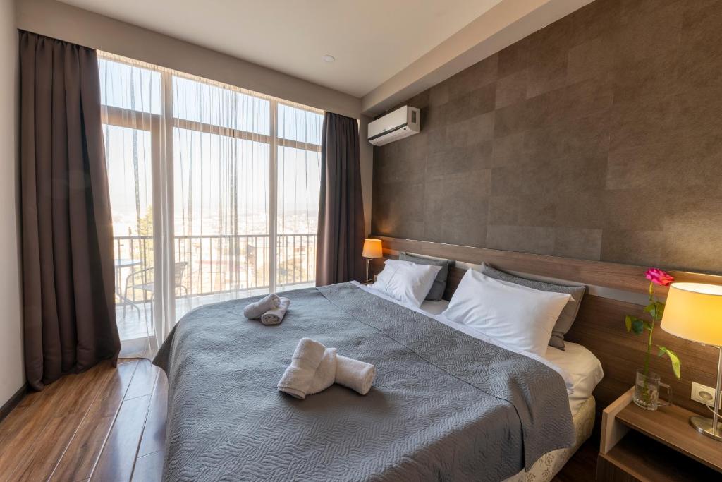 Postel nebo postele na pokoji v ubytování Sani Apart Hotel