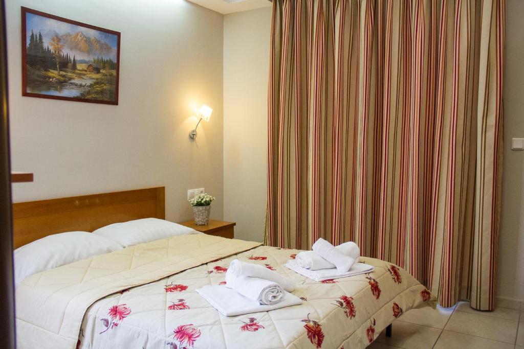 Postel nebo postele na pokoji v ubytování Hotel Rodon