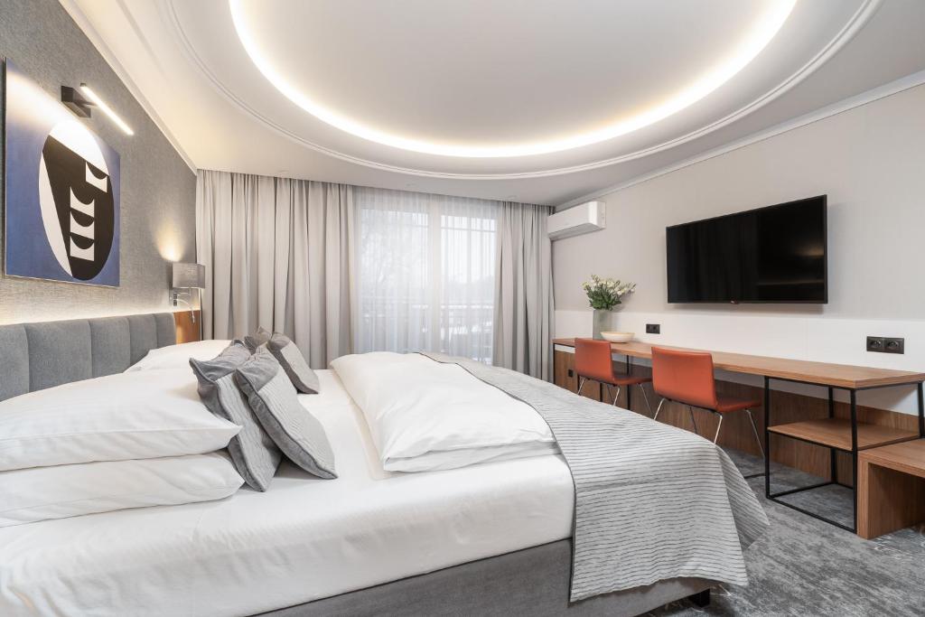 Televízia a/alebo spoločenská miestnosť v ubytovaní City Apartments - Młyńska 49
