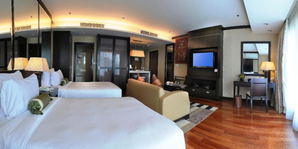 TV a/nebo společenská místnost v ubytování Micasa All Suites Hotel