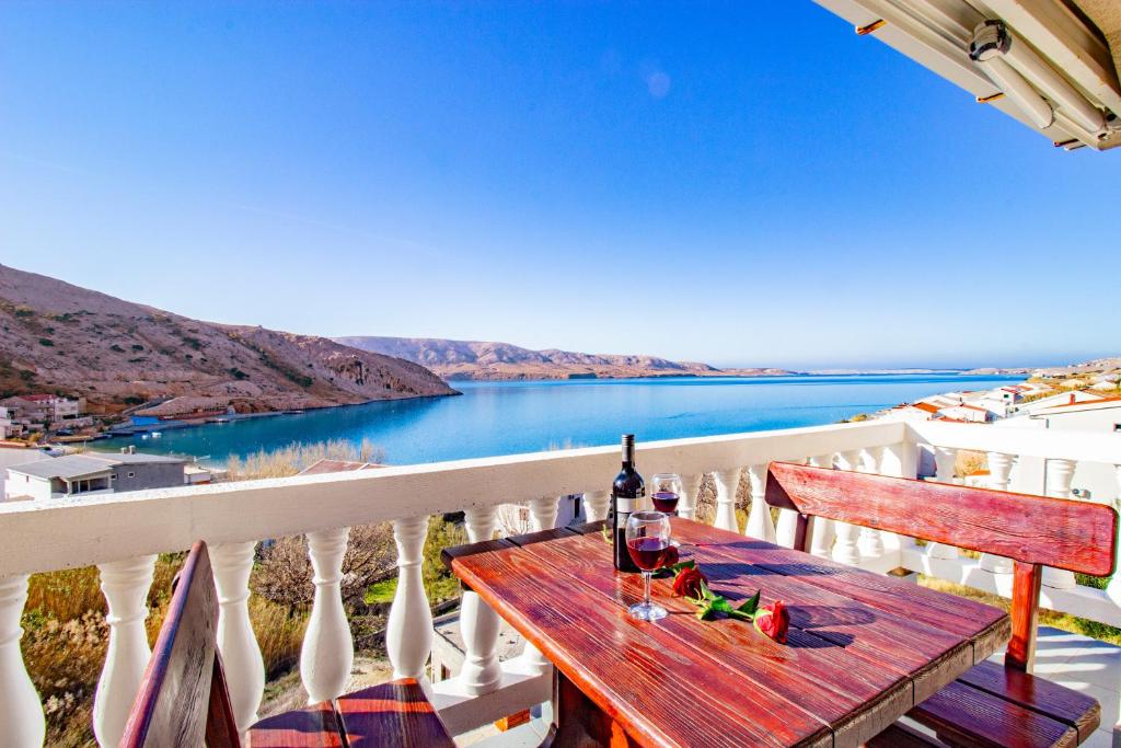 a table on a balcony with a view of the water at Diana mountain and seaview in Metajna