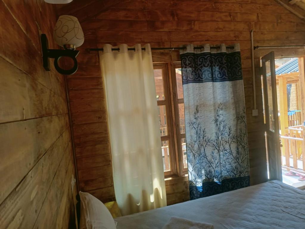 Letto o letti in una camera di Next ta Sea