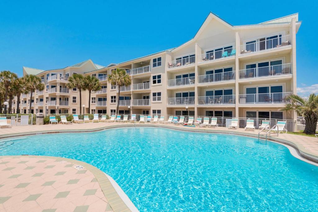 a large apartment building with a large swimming pool at Maravilla in Destin