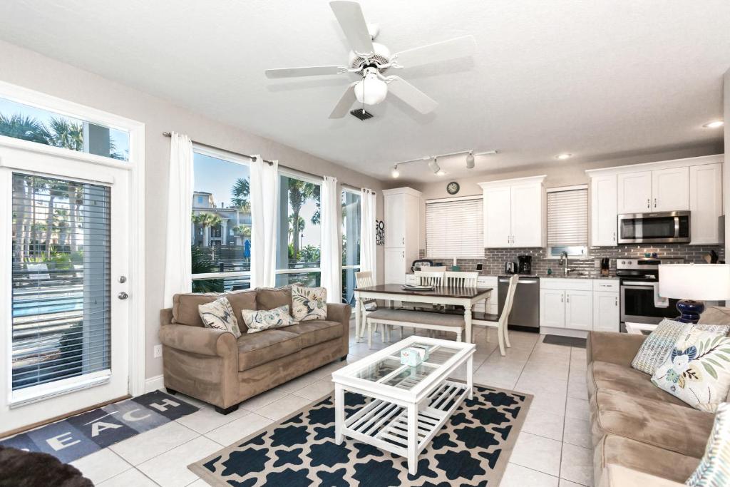 a living room with a couch and a table at Destiny Beach Villa 11B in Destin
