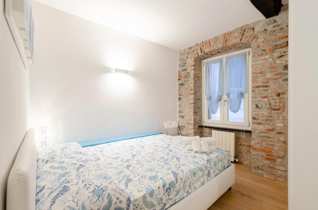 Posteľ alebo postele v izbe v ubytovaní Appartamento di design