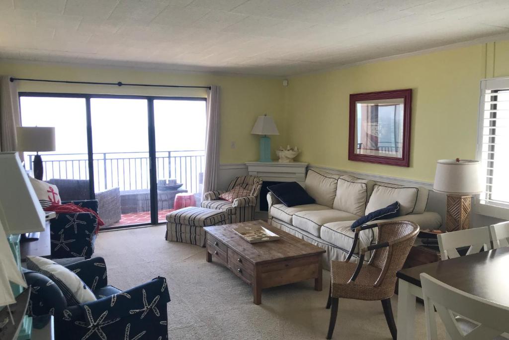 a living room with a couch and chairs and a table at Ocean Hideaway 511 in Ocean City