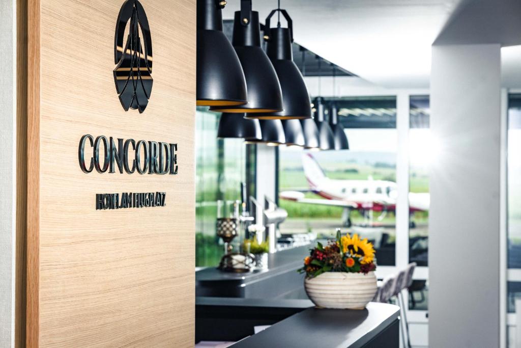 a restaurant with a sign that reads concourse endurance at Concorde Hotel am Flugplatz in Donaueschingen