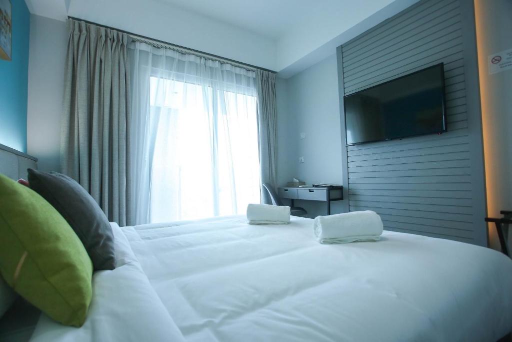 Postel nebo postele na pokoji v ubytování Stanton City Hotel