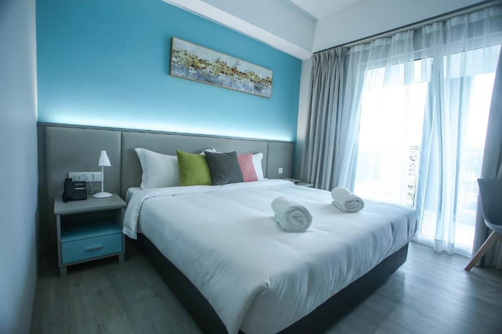 Postel nebo postele na pokoji v ubytování Stanton City Hotel
