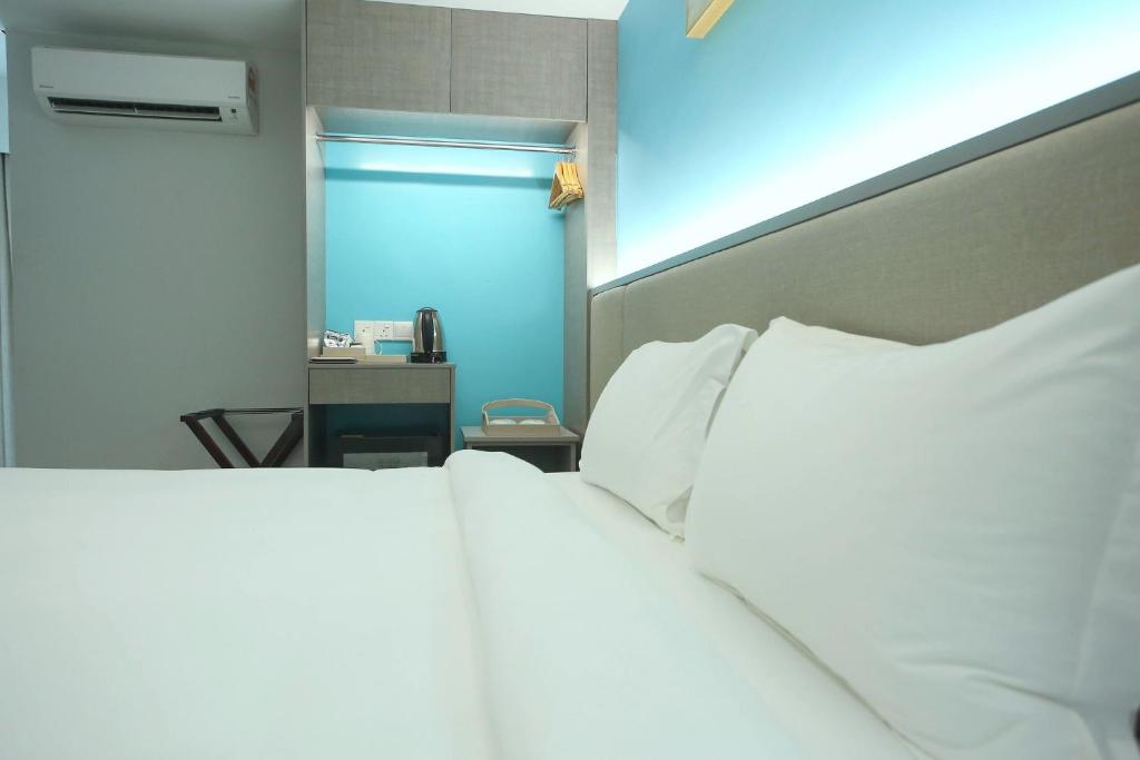 Postel nebo postele na pokoji v ubytování Stanton City Hotel