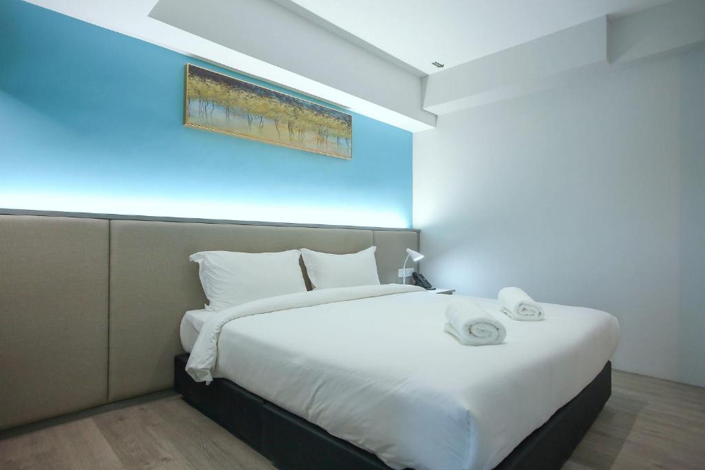Postel nebo postele na pokoji v ubytování Stanton City Hotel