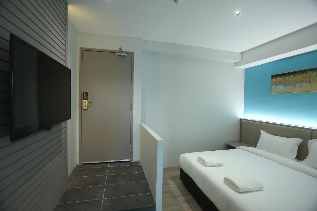 Postel nebo postele na pokoji v ubytování Stanton City Hotel
