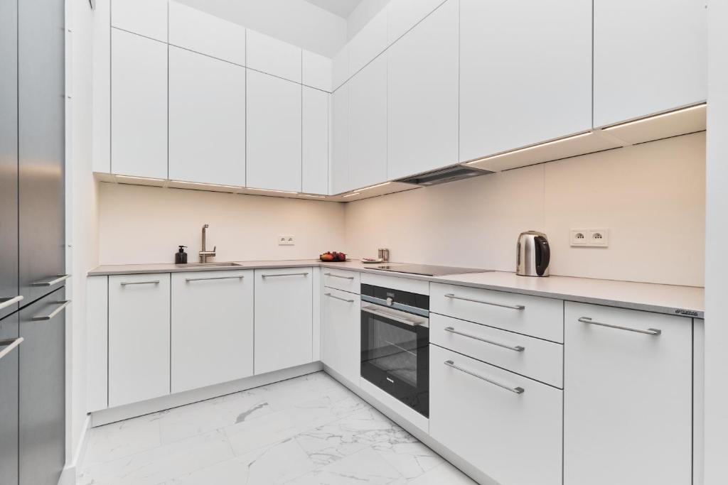 Kuchyňa alebo kuchynka v ubytovaní Apartments Młyn Maria Wrocław by Noclegi Renters