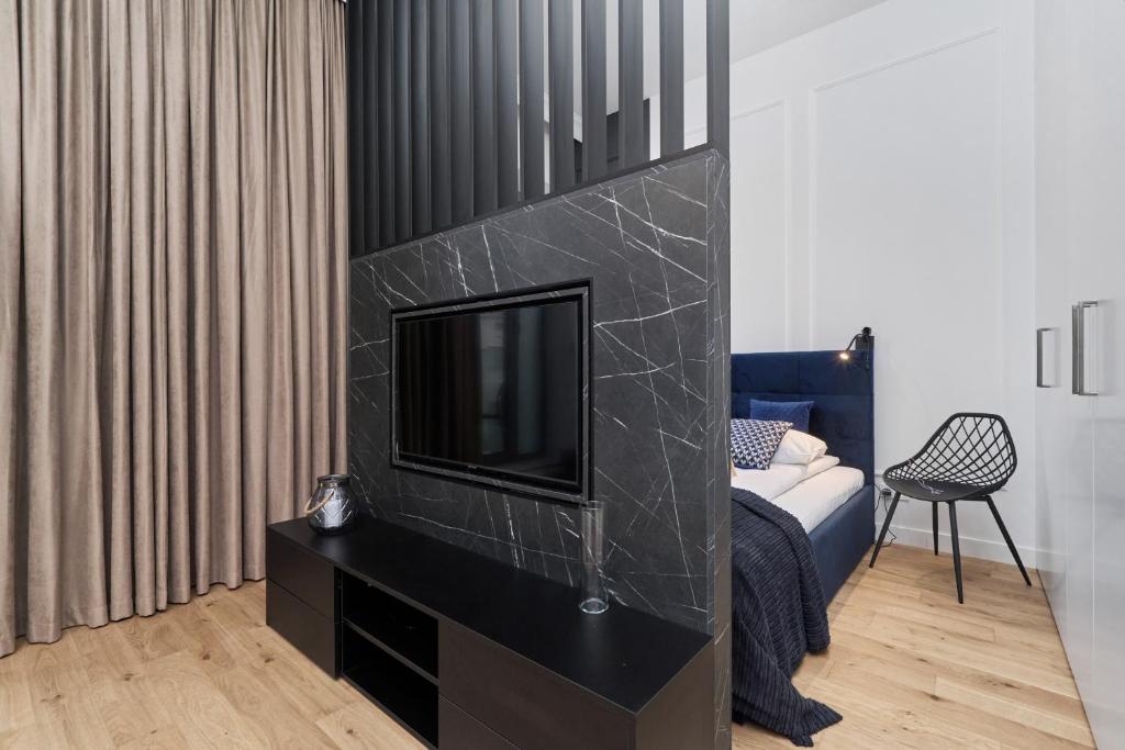 Posteľ alebo postele v izbe v ubytovaní Apartments Młyn Maria Wrocław by Noclegi Renters