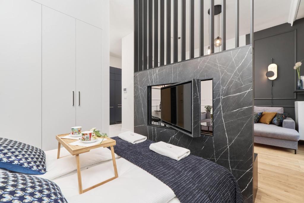 Posteľ alebo postele v izbe v ubytovaní Apartments Młyn Maria Wrocław by Noclegi Renters