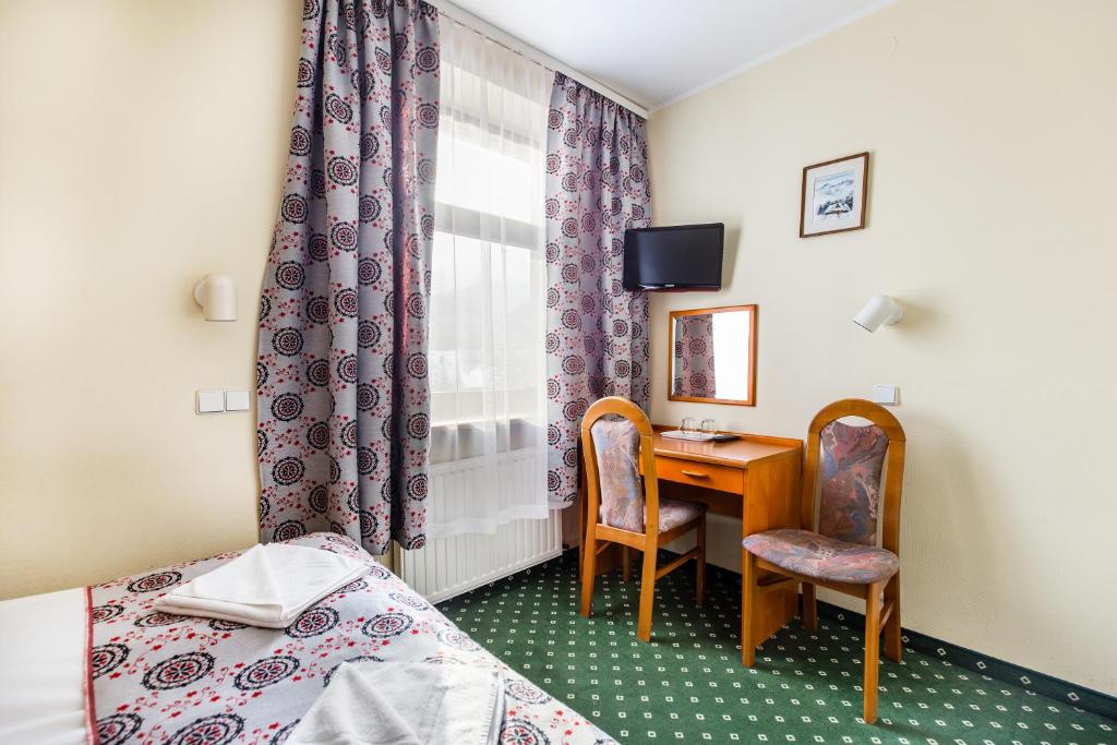 Posteľ alebo postele v izbe v ubytovaní Willa Excelsior