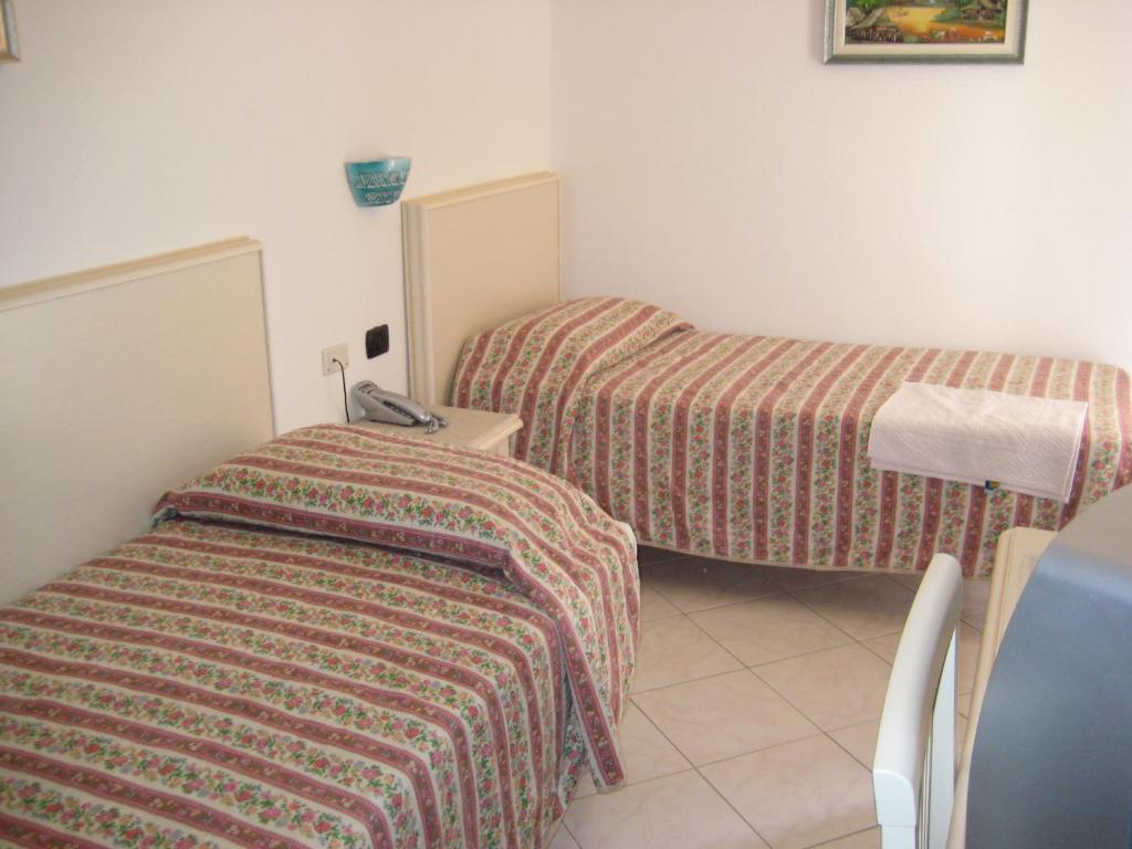 Postel nebo postele na pokoji v ubytování Scano Comfort Inn