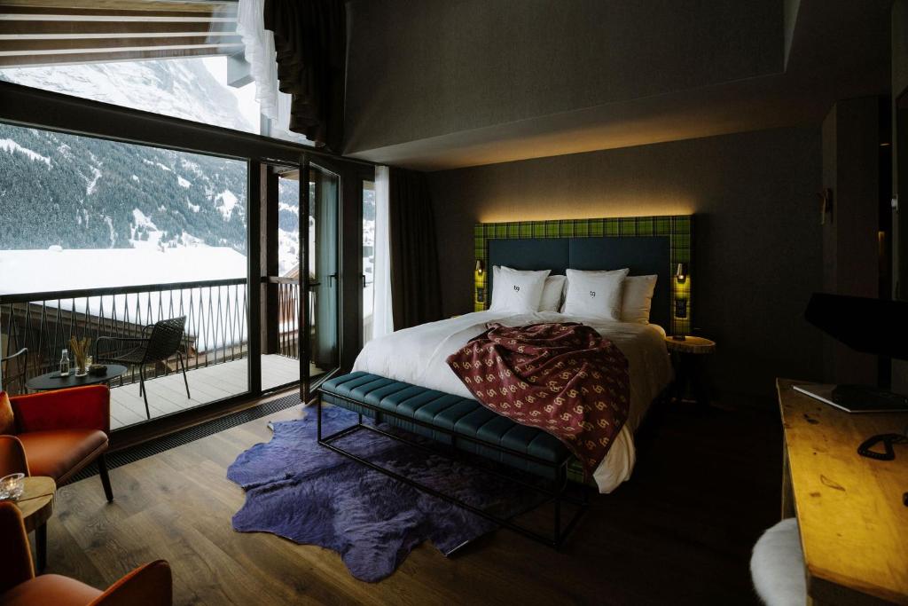 Postel nebo postele na pokoji v ubytování Bergwelt Grindelwald - Alpine Design Resort