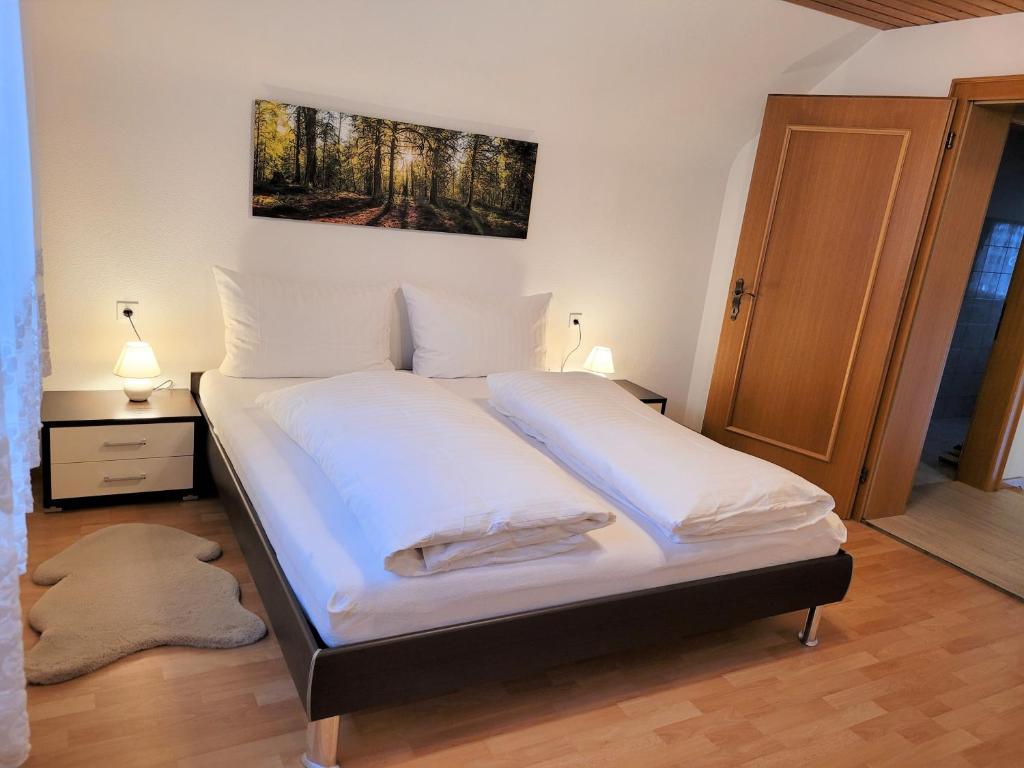 Кровать или кровати в номере Ferienhaus Hämmerle´s