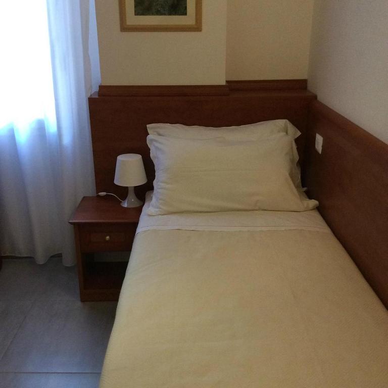 Postel nebo postele na pokoji v ubytování Buon Hotel Bologna Centro - Affittacamere - Self Check-In