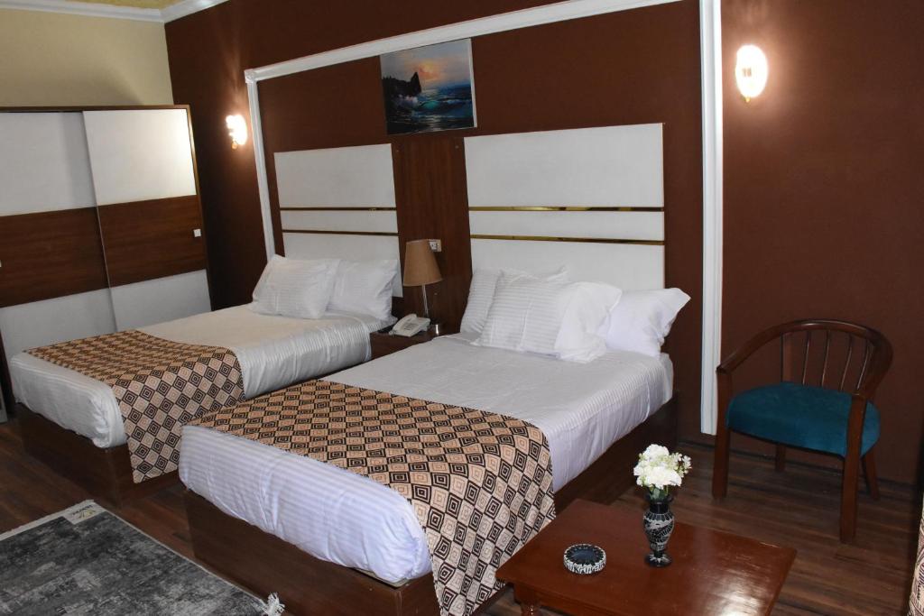 Postel nebo postele na pokoji v ubytování Jewel Luxor Hotel
