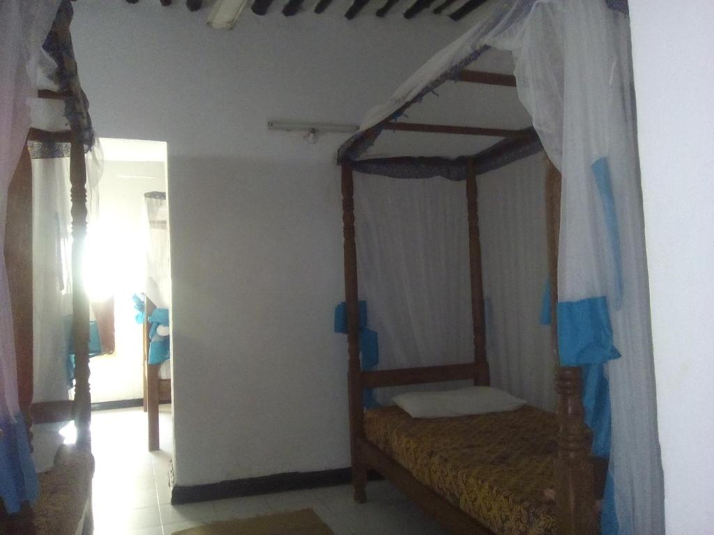 Postel nebo postele na pokoji v ubytování Kiponda B&B