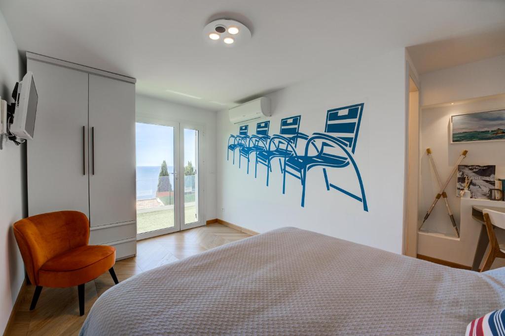 Postel nebo postele na pokoji v ubytování Villa Eze Vue Mer