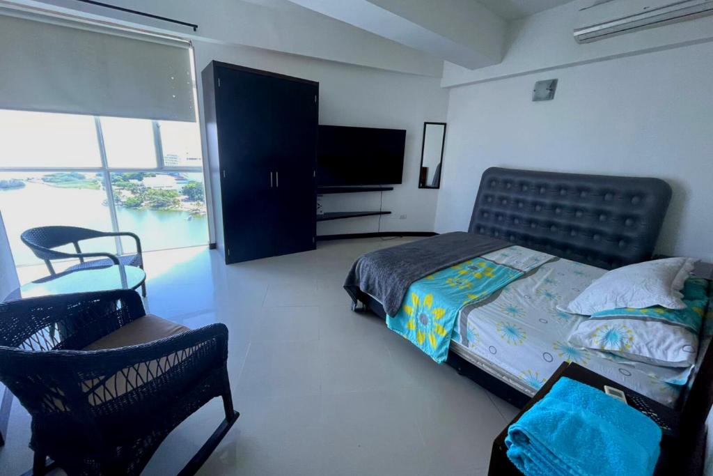 Кровать или кровати в номере Apartamento en Cartagena con Espectacular Vista en El Laguito Bocagrande