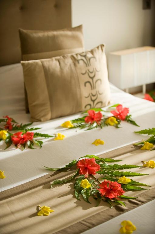 Postel nebo postele na pokoji v ubytování Raiatea Lodge Hotel