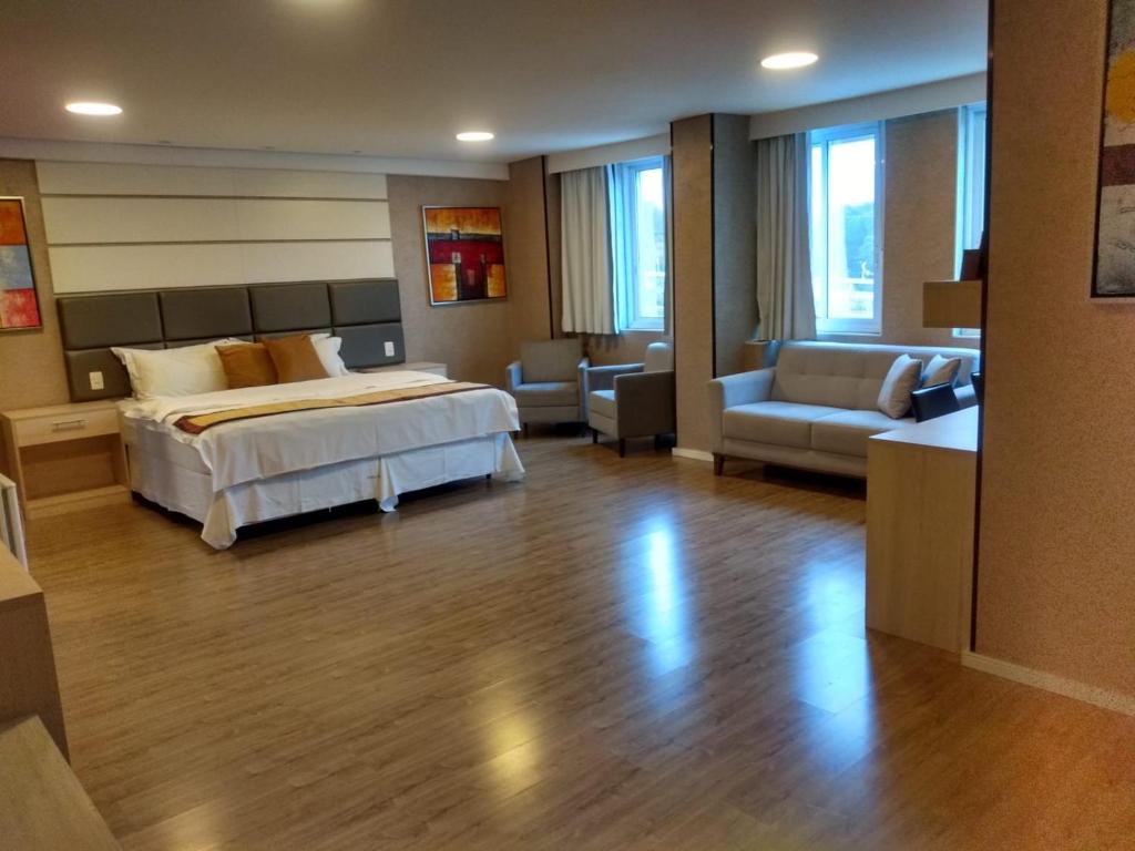 Cama ou camas em um quarto em Hotel Global Grupos