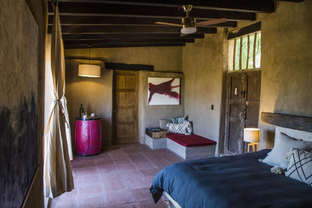 Postel nebo postele na pokoji v ubytování Hotel de Tierra Viñedo y Spa - Aeropuerto Querétaro