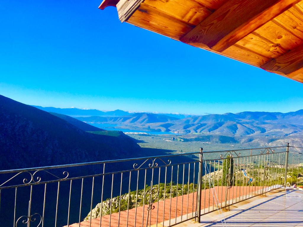 a balcony with a view of the mountains at delphi aiolos center hotel panoramic view&yoga harmony hotel&rooms in Delphi