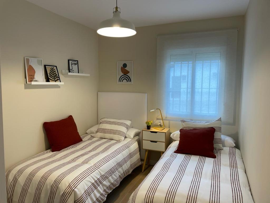 Postel nebo postele na pokoji v ubytování Apartamento Jerez 2022