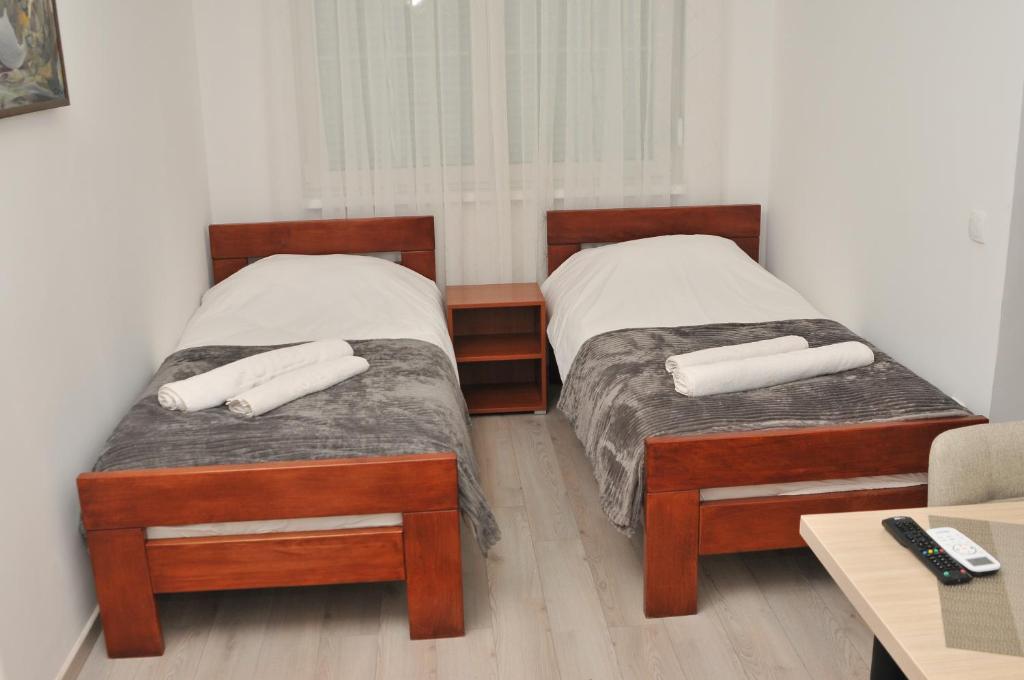Postel nebo postele na pokoji v ubytování "Astor16" Apartments