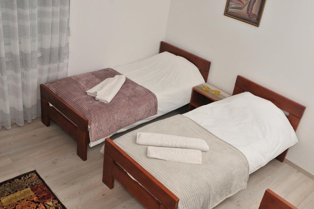 Postel nebo postele na pokoji v ubytování "Astor16" Apartments