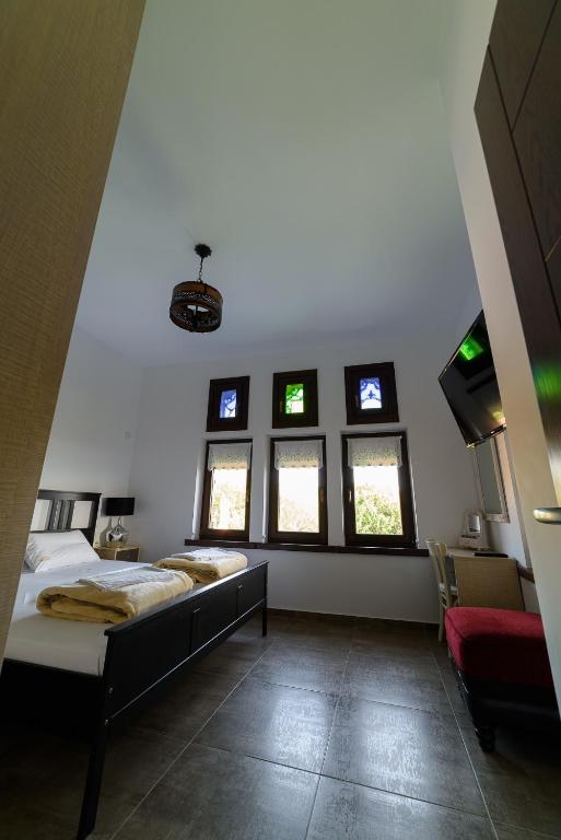 Postel nebo postele na pokoji v ubytování Mansion Chalatsopoulos