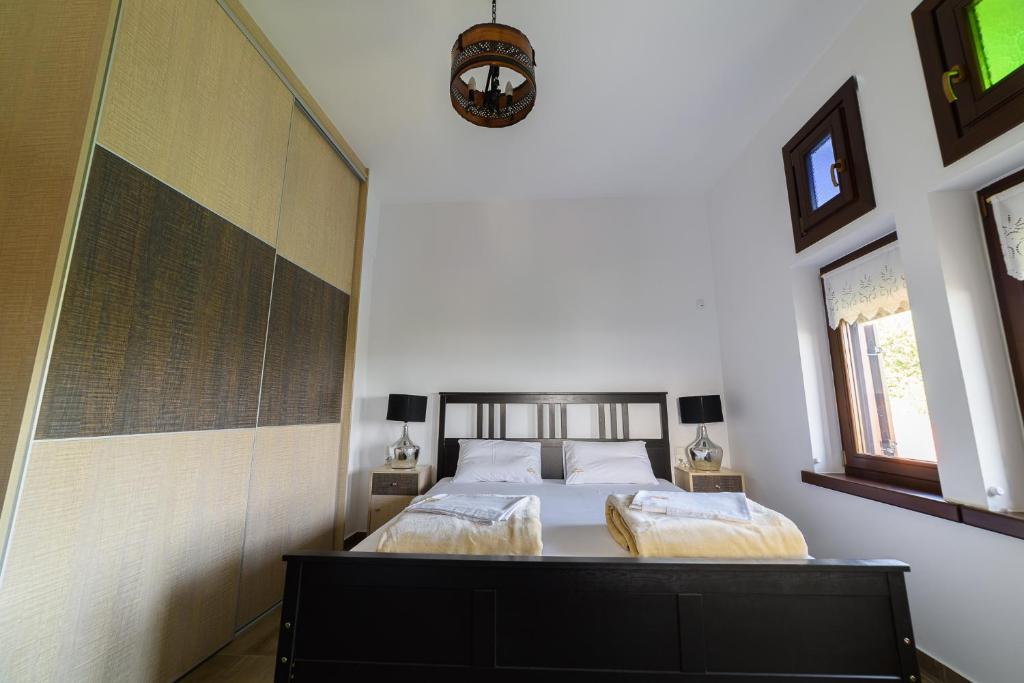 Postel nebo postele na pokoji v ubytování Mansion Chalatsopoulos