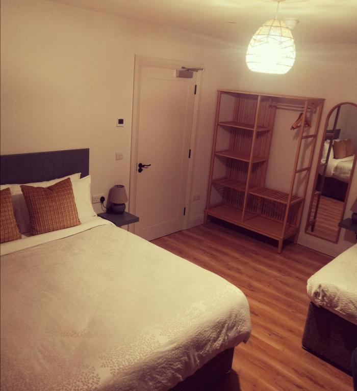 Postel nebo postele na pokoji v ubytování Cedar Lodge