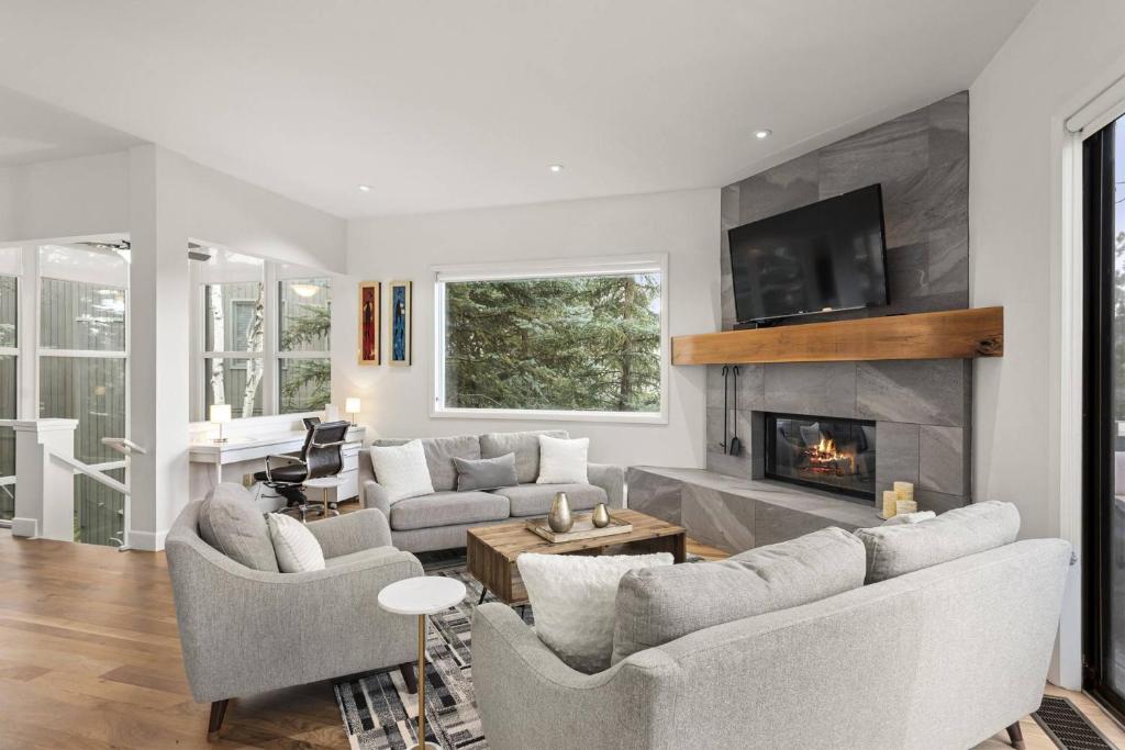 a living room with two couches and a fireplace at Snowmass 3 Bedroom Private Hot Tub in Snowmass Village