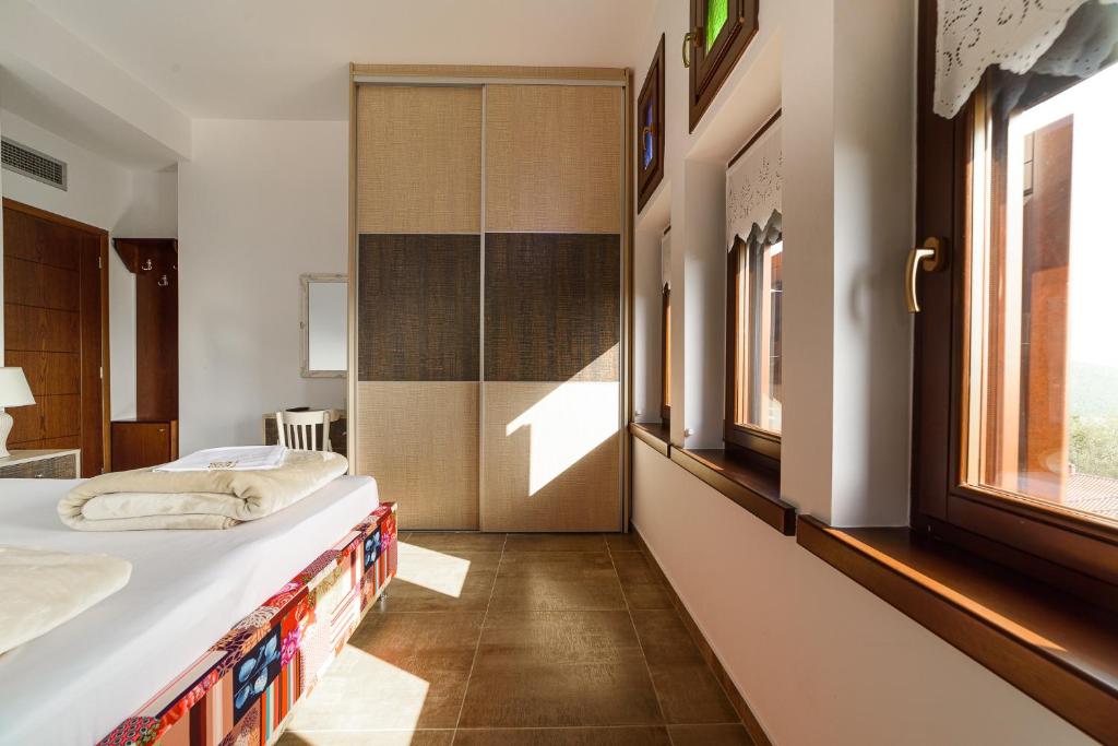 Postel nebo postele na pokoji v ubytování Mansion Chalatsopoulos