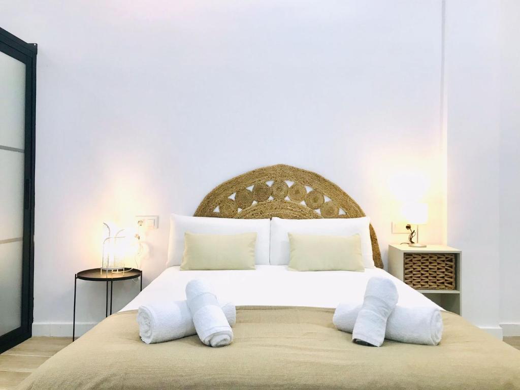 Posteľ alebo postele v izbe v ubytovaní Munilla & Beach by ELE Apartments