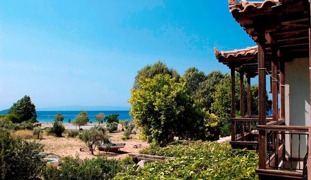 a view of the ocean from a house at Athina Apartments in Neo Klima