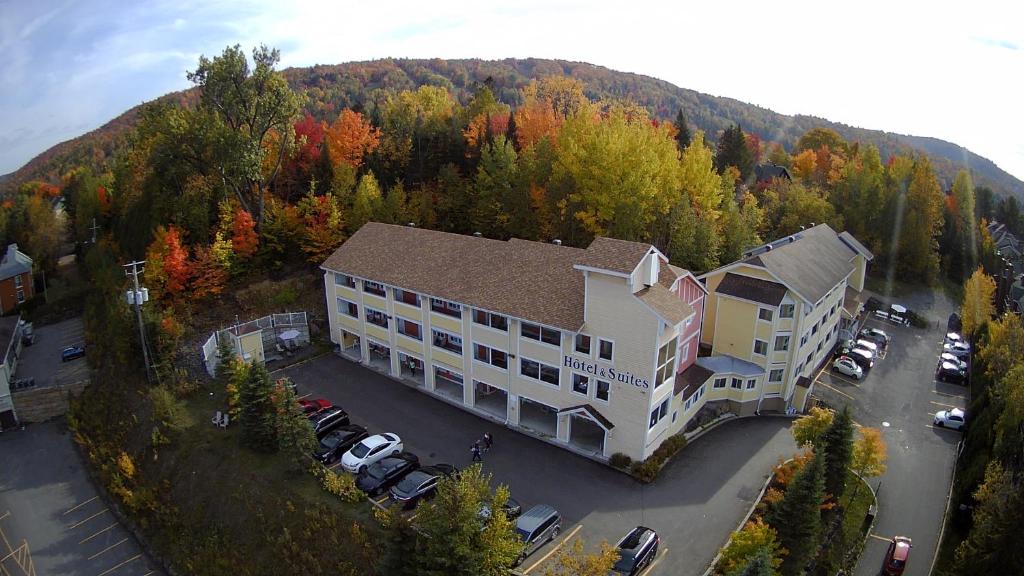 an aerial view of a large building with a parking lot at Hotel and Suites Les Laurentides in Saint-Sauveur-des-Monts