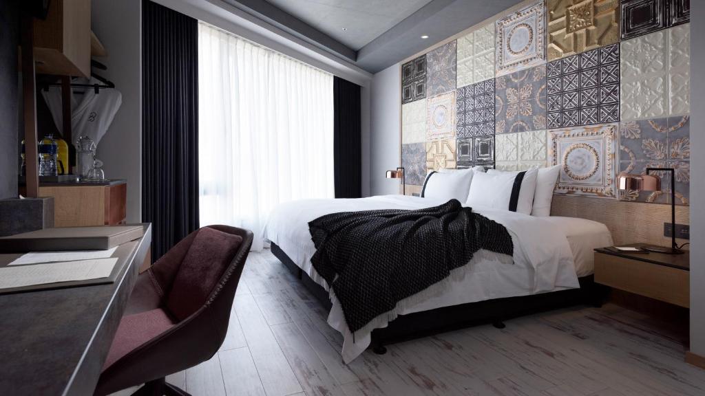 Postel nebo postele na pokoji v ubytování Brio Hotel