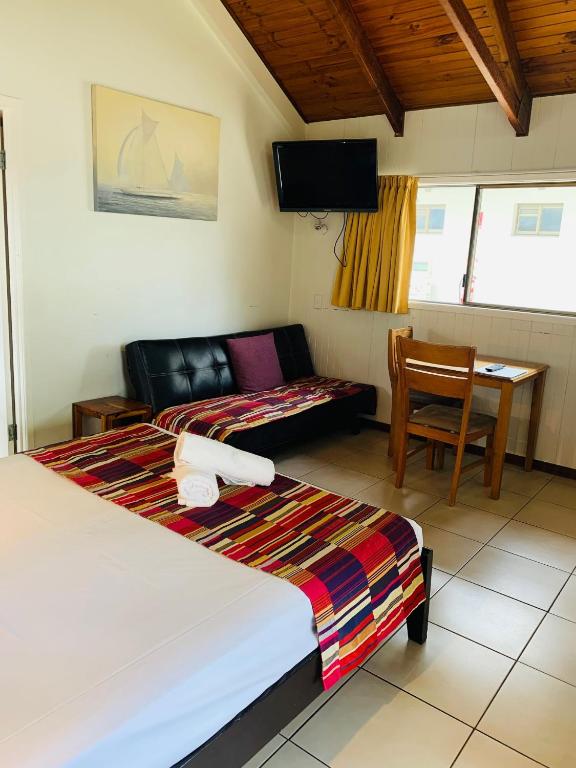 Postel nebo postele na pokoji v ubytování Airlie Beach Apartments