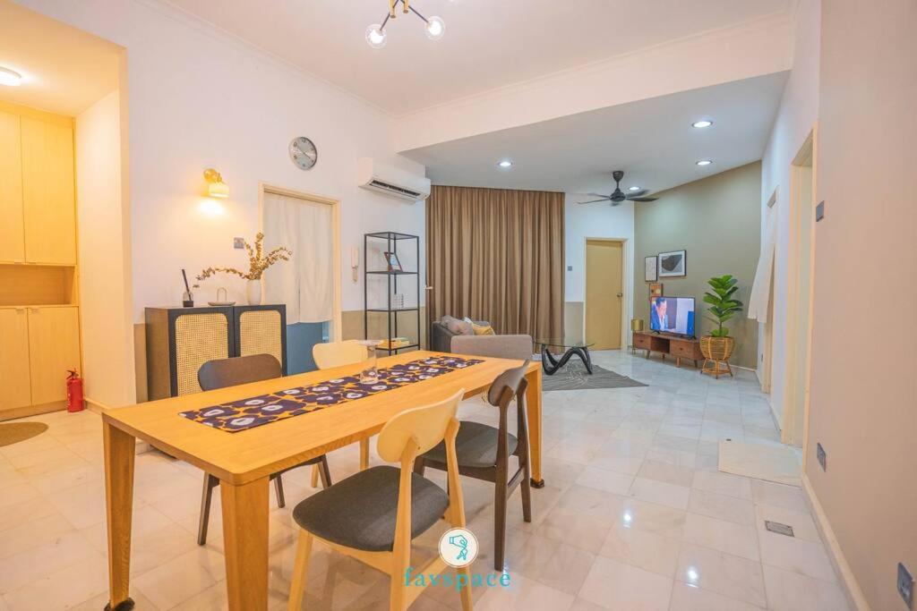 a living room with a table and chairs at Doorstep - Sunway Putra Mall - Close to PWTC for 4 in Kuala Lumpur