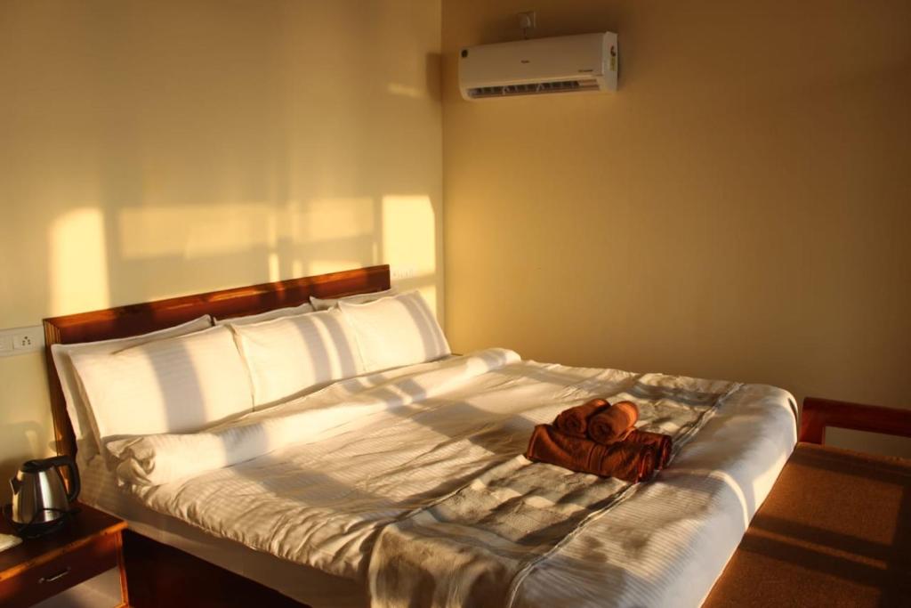 Postel nebo postele na pokoji v ubytování Agonda Wellness
